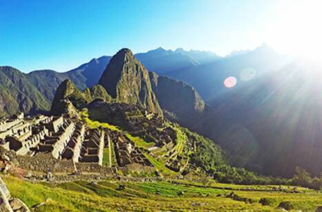 Sun shining over Peru's Machu Picchu