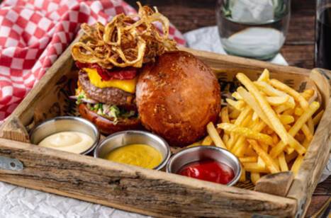 Closeup photo of three American cheeseburgers