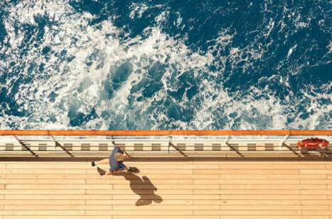 A guest running on deck of a Cunard ship