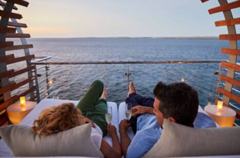 A couple relaxing aboard a Celebrity Cruises ship