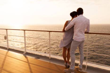 Panoramic image of a couple watching the horizon on a cruise ship