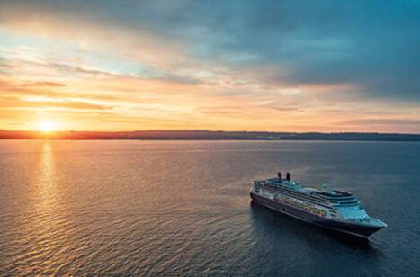 Borealis at sea during sunset