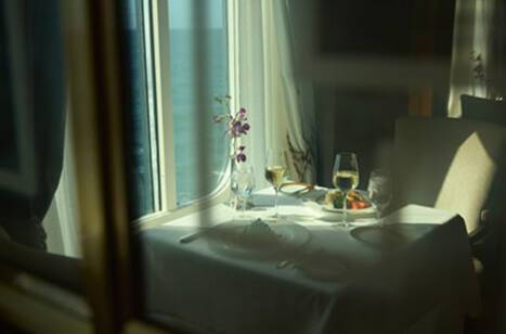 A table by a window on a cruise ship