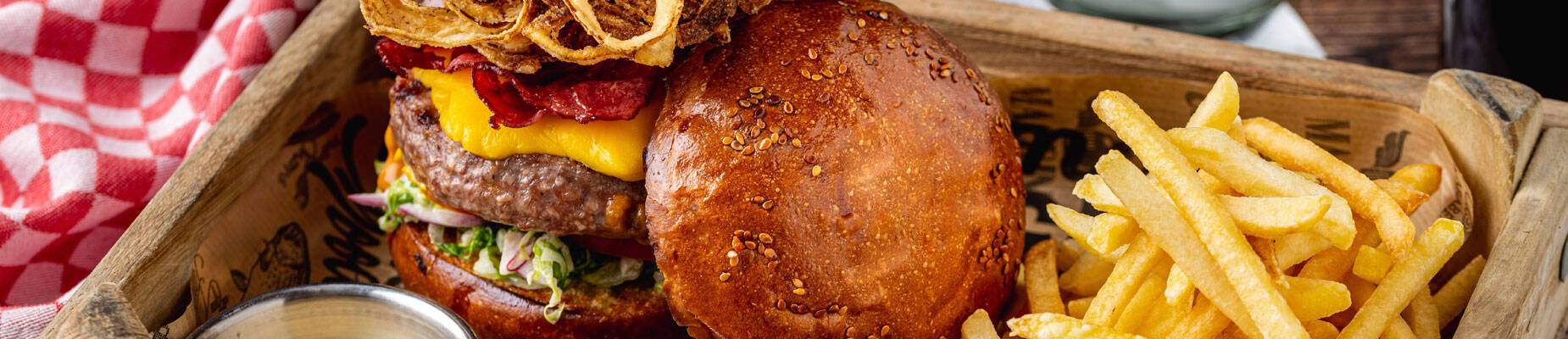Closeup photo of three American cheeseburgers