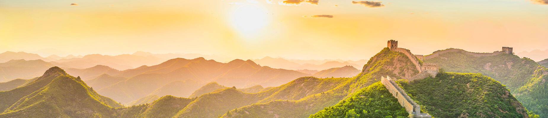 A panoramic view of the Great Wall of China at sunrise