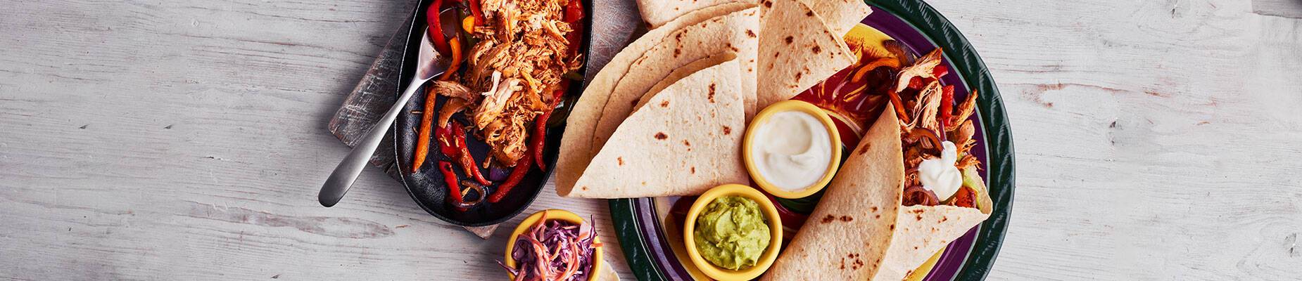 Aerial view of chicken fajitas on a hot plate