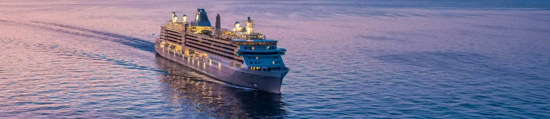 Silver Nova sailing at dusk