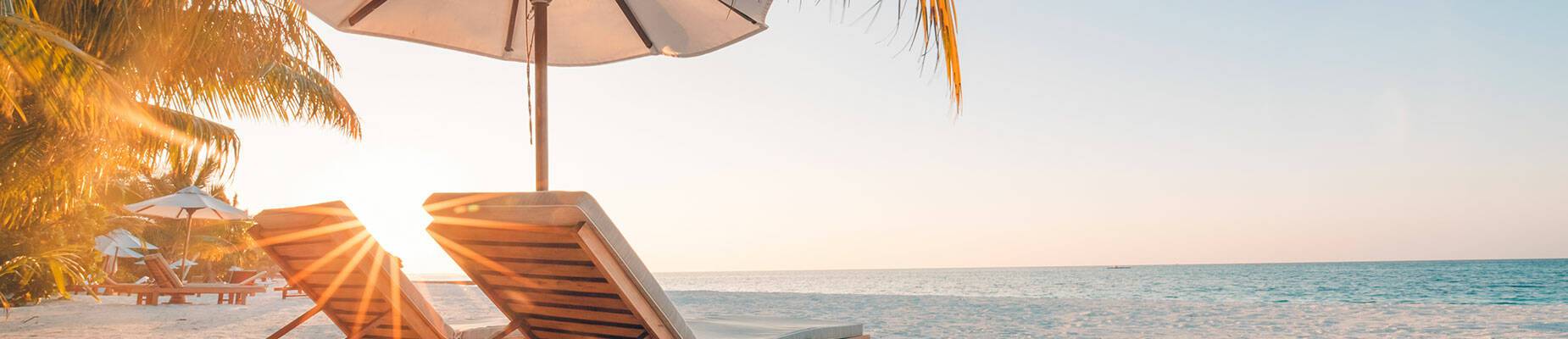 Two deck chairs on a picturesque Caribbean beach