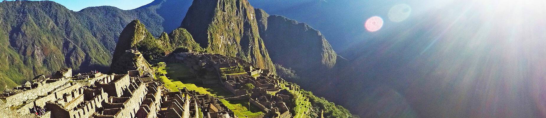 Sun shining over Peru's Machu Picchu