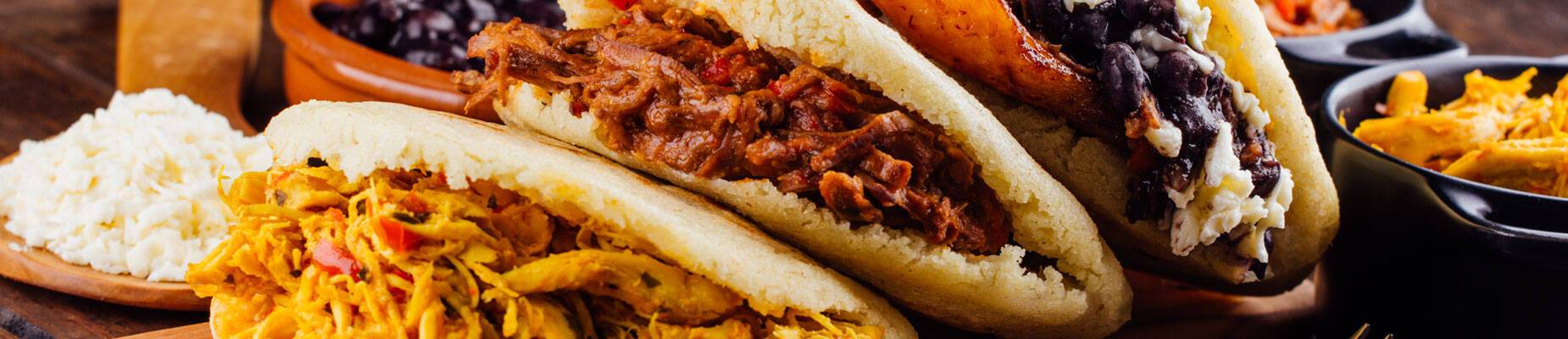 Three arepas on a platter