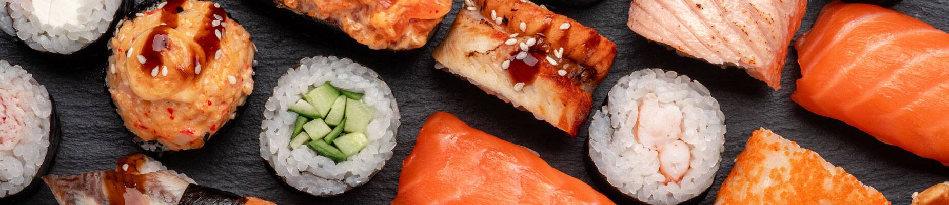 A panoramic image of different types of sushi