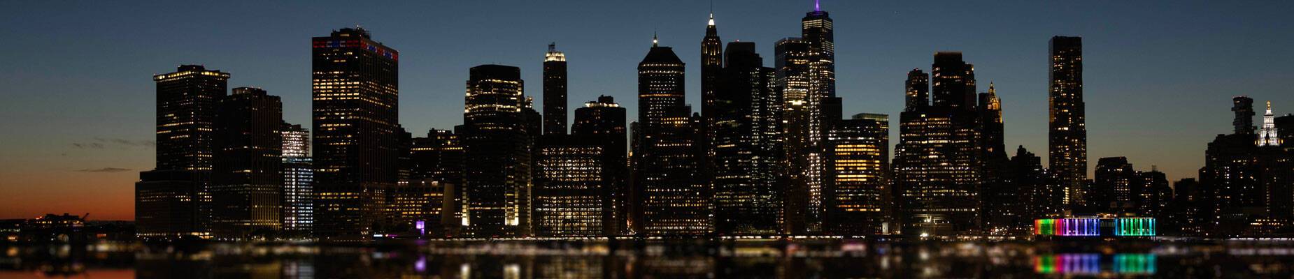 Panoramic image of New York skyline at night