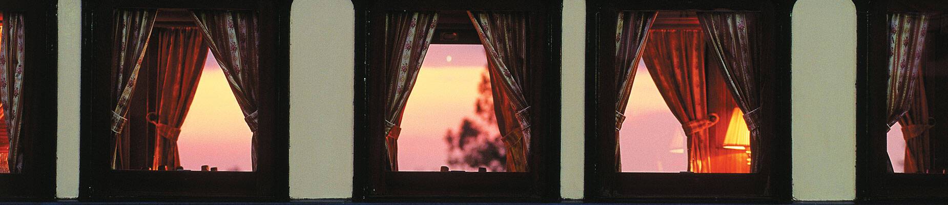 The view of the sunset through a Rovos Rail train carriage