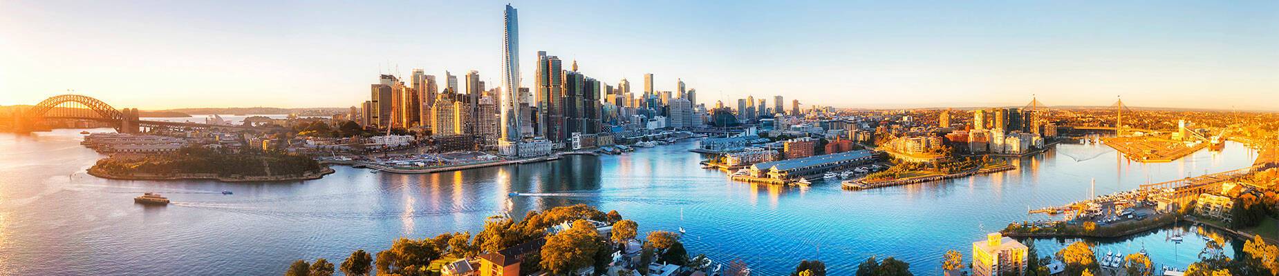 A panoramic view of Sydney's landscape at sunrise