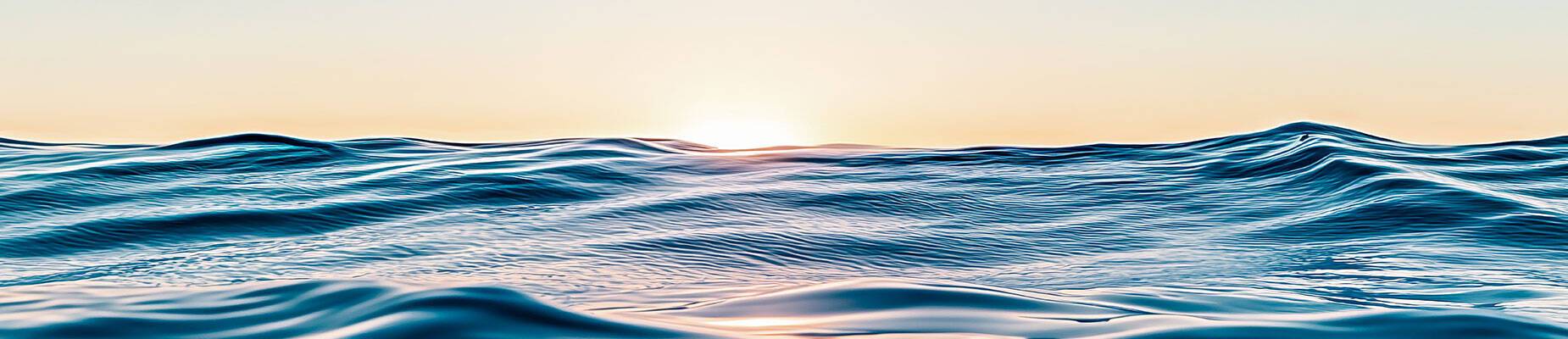 The sun rising on the horizon of the sea