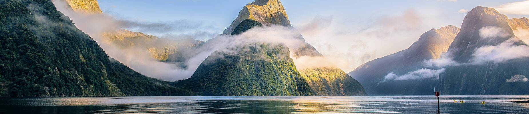 The sun setting over New Zealand's Milford Sound