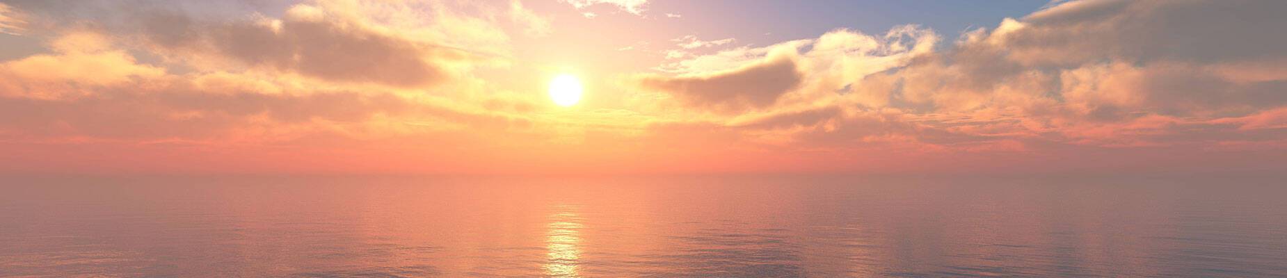 An image of the sun setting over the sea