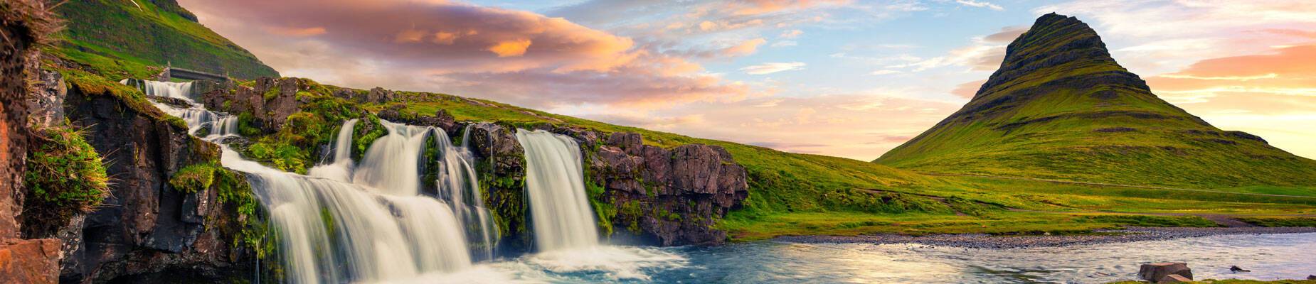 Panoramic image of the famous Kirkjufellsfoss Waterfall and Kirkjufell mountain in the Snaefellsnes peninsula, Iceland