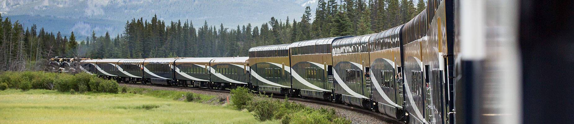An image of the Rocky Mountaineer train against the backdrop of Canada