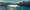 A panoramic view of boats passing through Dutch Harbor