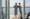 A couple standing on the balcony of a cruise ship