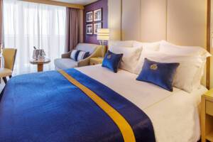 Britannia Club Balcony Bedroom, Queen Mary 2, Cunard - Image based on an A2 grade, configuration may differ