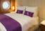 De Luxe Suite Bedroom. Ambition, Ambassador Cruise Line