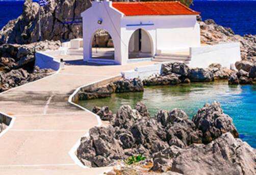 A church on the waters edge in Chios