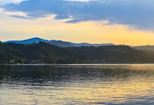 A panoramic view of Donji Milanovac at sunset