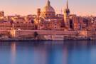The sun rising over Valletta