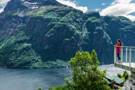 Girl looking out at a fjord from Hellesylt's lookout