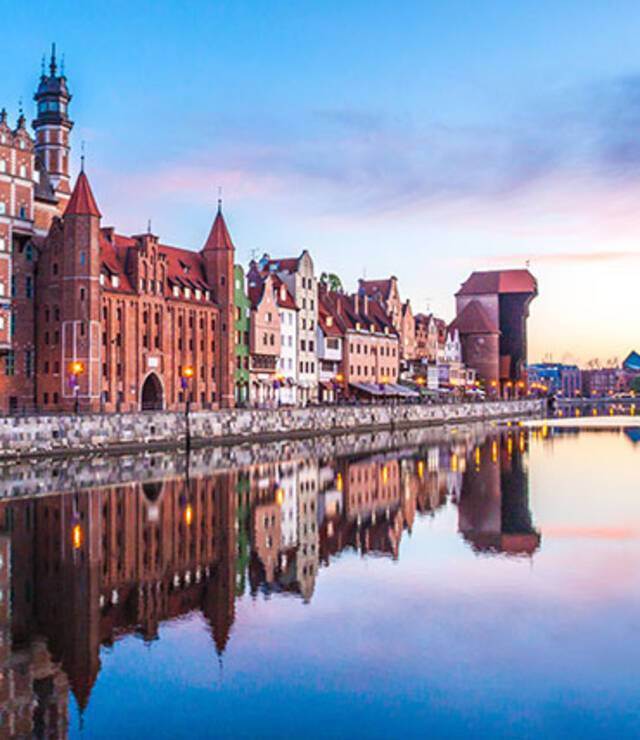 The cityscape of Gdansk reflected in the water