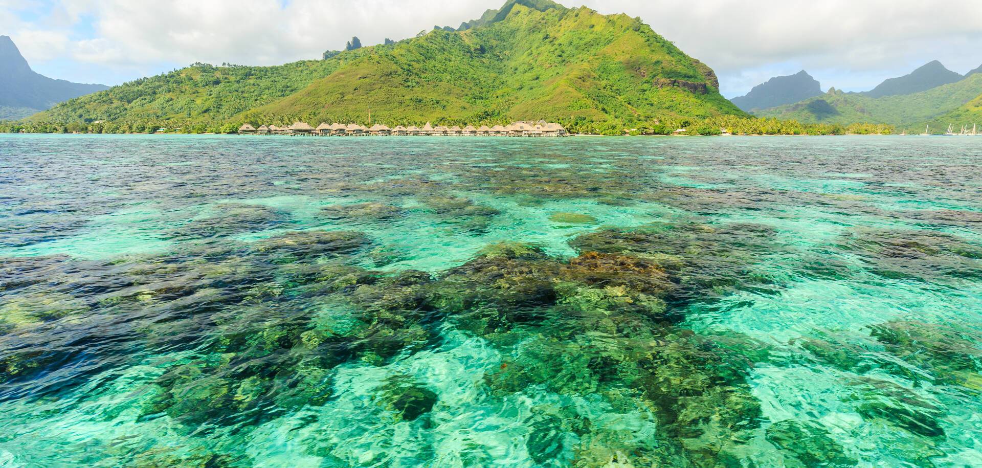 Beautiful sea with mountain and resort background in Moorae Island at Tahiti