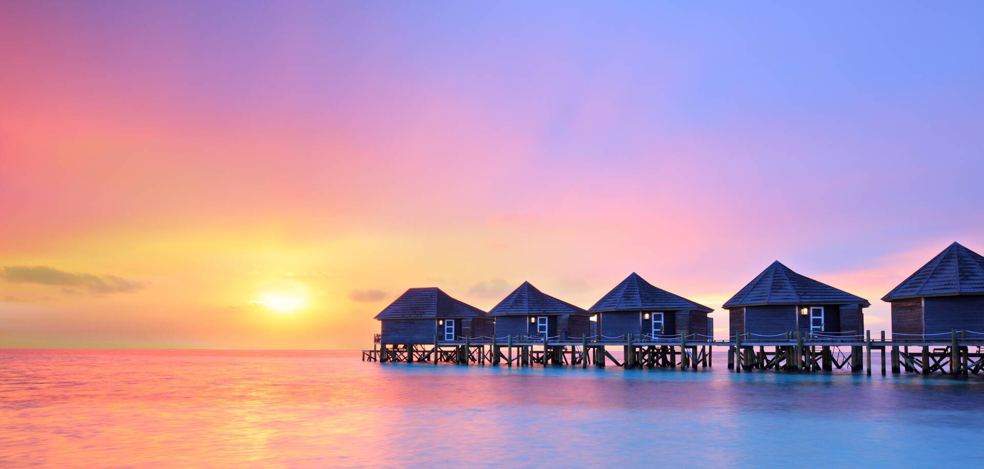 Sunset over Male and Water Bungalows