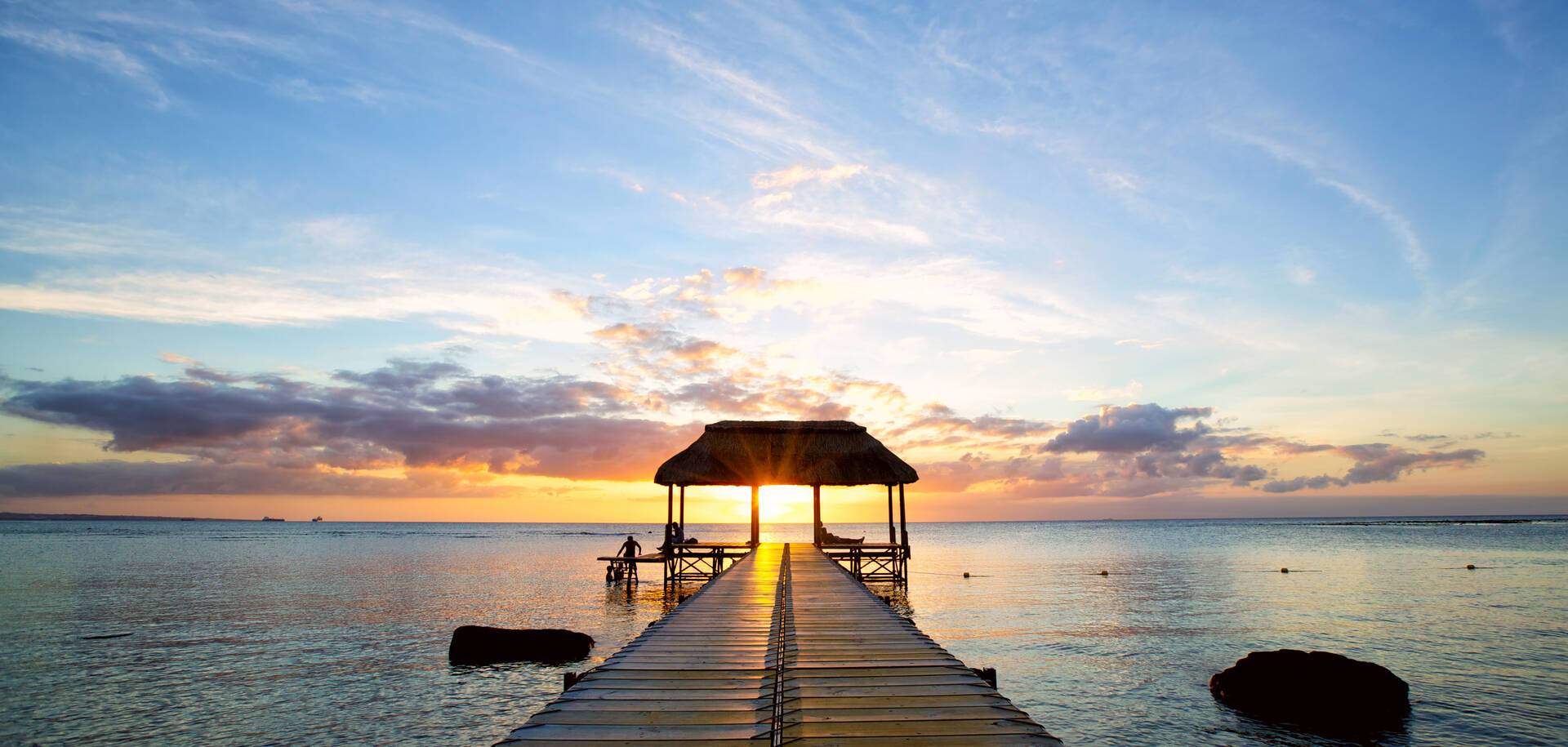 Jetty silhouette against beautiful sunset in Mauritius Island