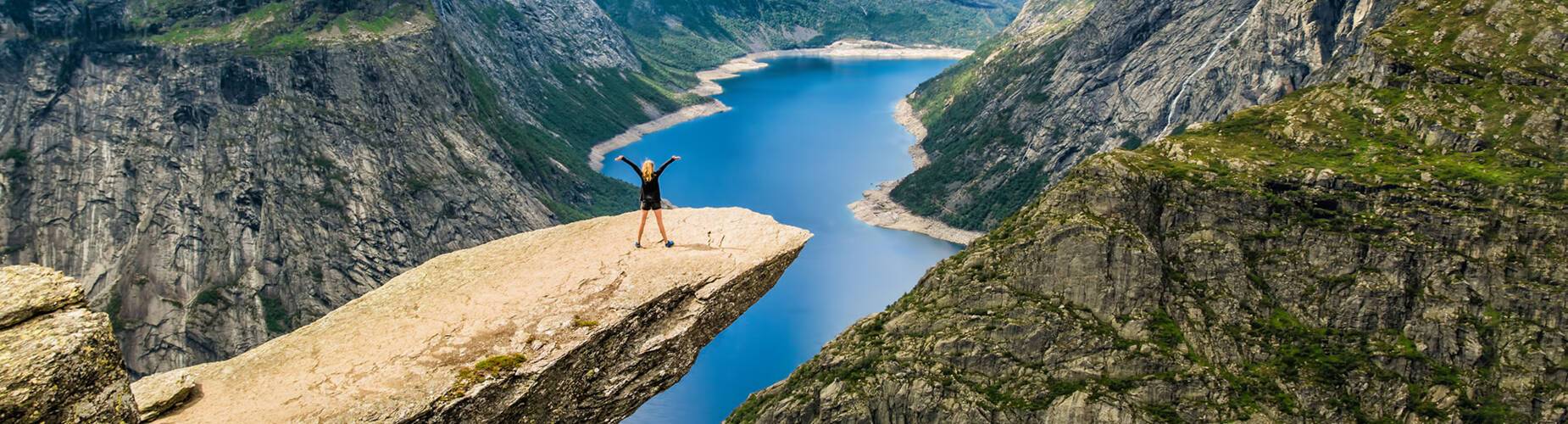 Girl standing on Trolltunga in Stavanger