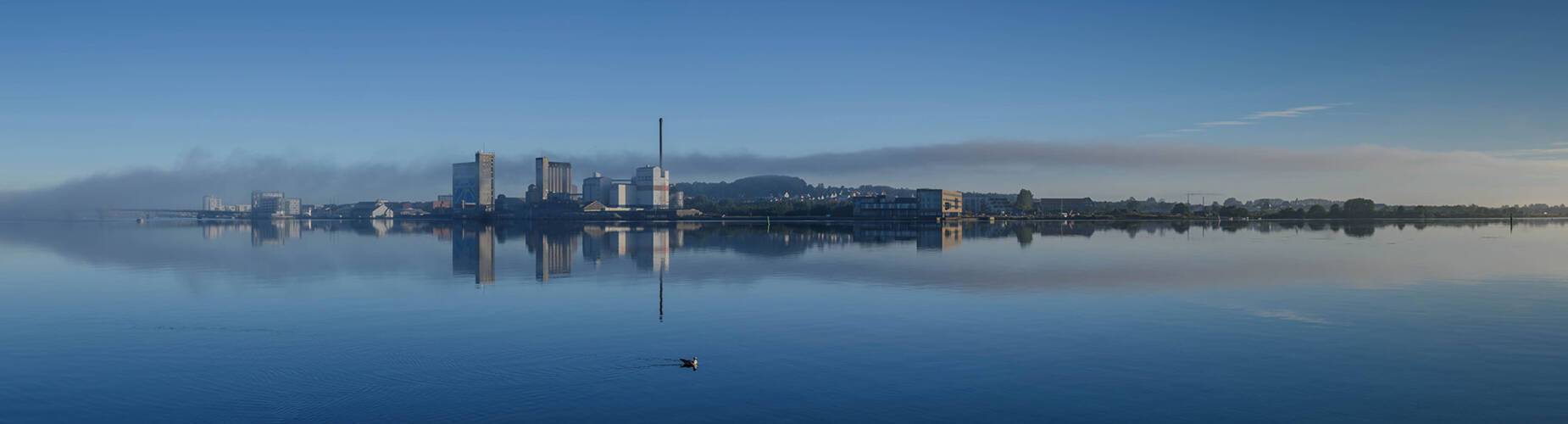 A panoramic view of a misty Aalborg