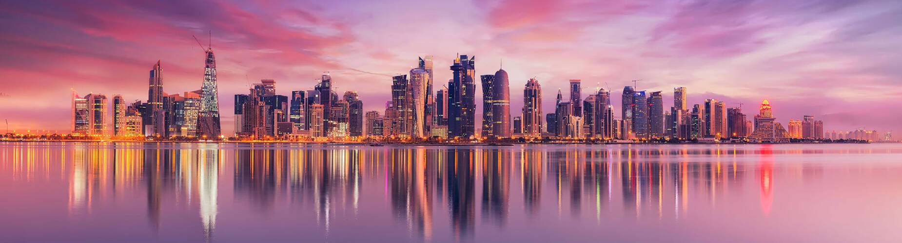 Doha's cityscape reflected in the water
