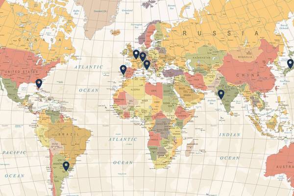 Vintage world map with location pins 